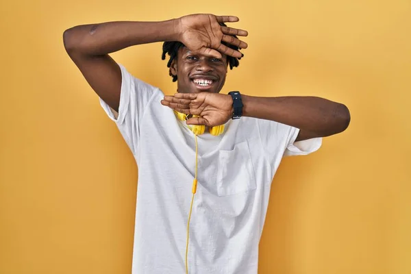Young African Man Dreadlocks Standing Yellow Background Smiling Cheerful Playing — Stock Photo, Image