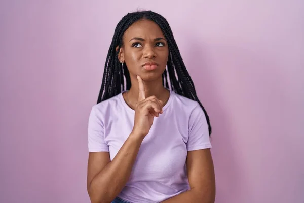 African American Woman Braids Standing Pink Background Thinking Concentrated Doubt —  Fotos de Stock