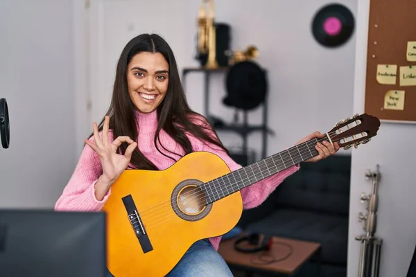 Young Brunette Woman Playing Classic Guitar Music Studio Doing Sign — Stock Photo, Image