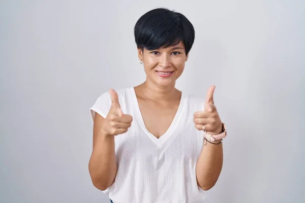 Young Asian Woman Short Hair Standing Isolated Background Pointing Fingers — Stok fotoğraf