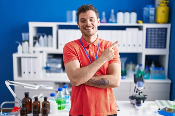 Young Hispanic Man Working Scientist Laboratory Big Smile Face Pointing — Photo