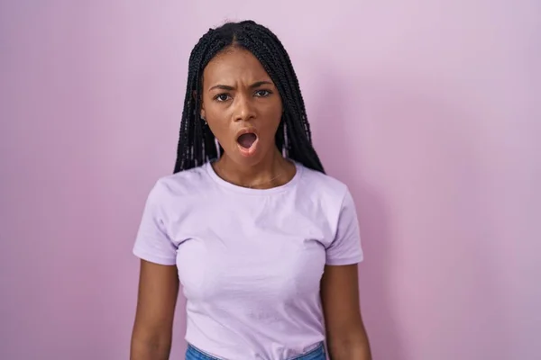 African American Woman Braids Standing Pink Background Shock Face Looking — 图库照片