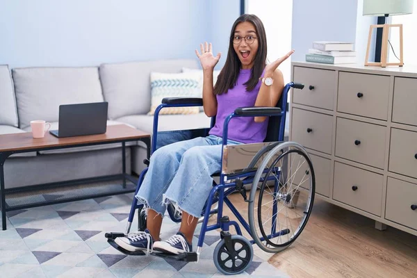 Young Hispanic Woman Sitting Wheelchair Home Celebrating Crazy Amazed Success — Stock fotografie