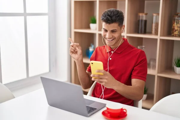 Young Hispanic Man Using Laptop Doing Video Call Smartphone Smiling — Stock fotografie