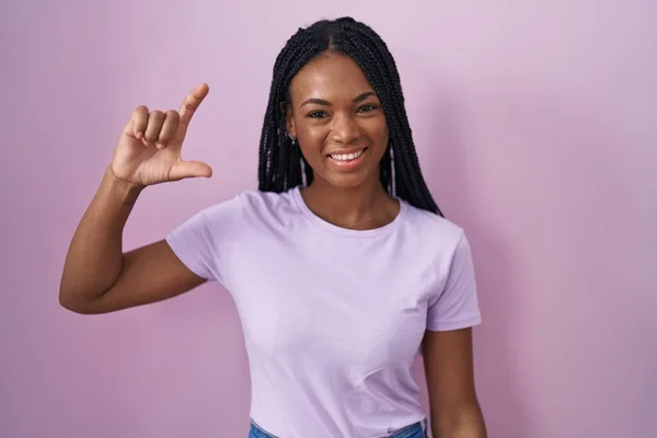 African American Woman Braids Standing Pink Background Smiling Confident Gesturing — Stockfoto