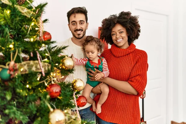Couple Daughter Smiling Confident Decorating Christmas Tree Home — Stockfoto