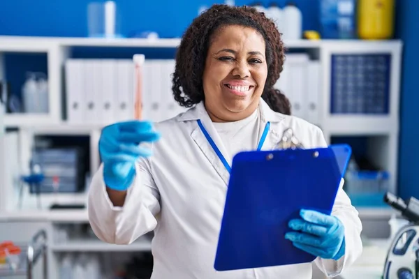 African American Woman Scientist Reading Document Holding Test Tube Laboratory — Fotografia de Stock