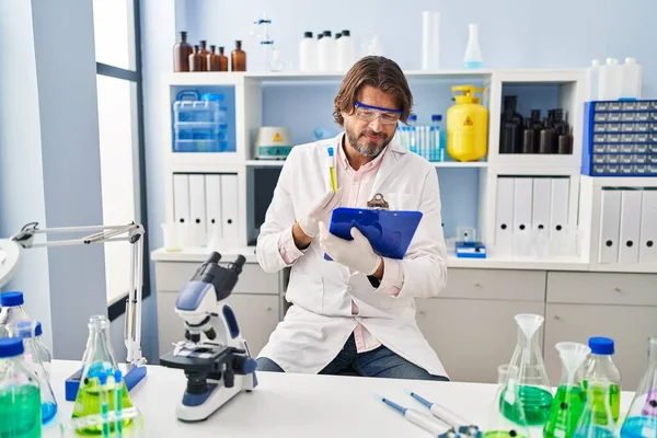 Middle Age Man Scientist Holding Test Tube Reading Document Laboratory — Stock Photo, Image