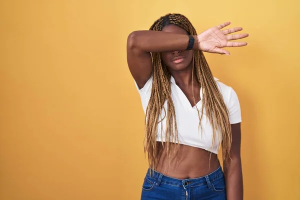 African American Woman Braided Hair Standing Yellow Background Covering Eyes — Photo
