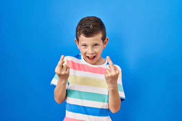 Young Caucasian Kid Standing Blue Background Showing Middle Finger Doing — Stockfoto