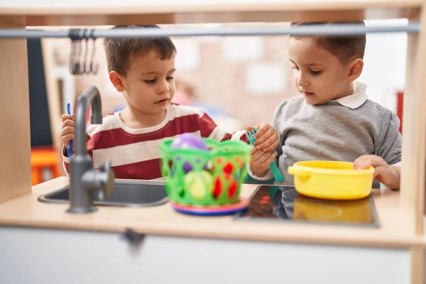 Two Kids Playing Play Kitchen Standing Kindergarten — Stock Photo, Image