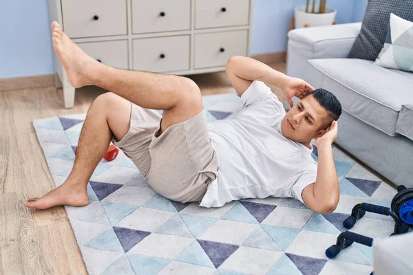 Young Latin Man Training Abs Exercise Home — Φωτογραφία Αρχείου