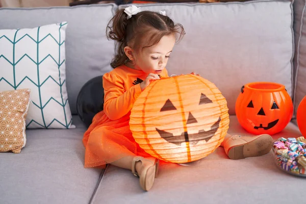 Adorable Hispanic Toddler Having Halloween Party Holding Pumpkin Toy Home — Stok fotoğraf