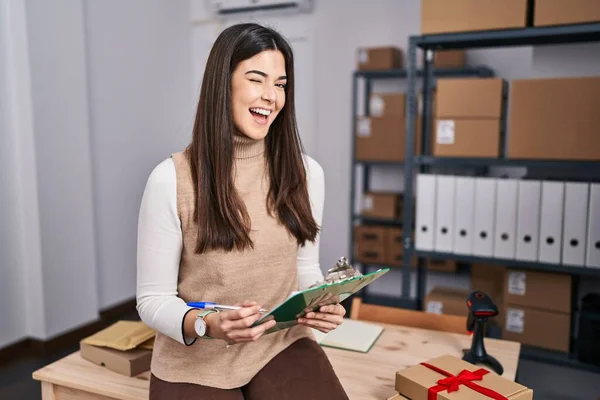 Young Brunette Woman Working Small Business Ecommerce Winking Looking Camera — Stockfoto