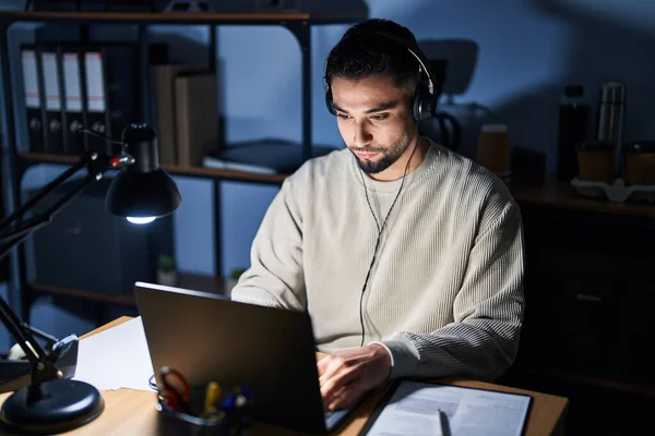 Young Handsome Man Working Using Computer Laptop Night Relaxed Serious — Stockfoto
