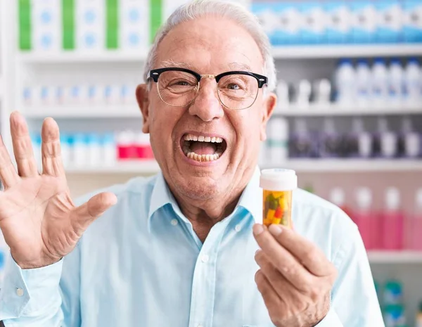Senior Man Grey Hair Holding Pills Pharmacy Celebrating Victory Happy — Fotografia de Stock