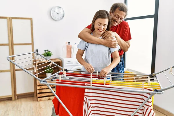Middle Age Man Woman Couple Hugging Hanging Clothes Clothesline Laundry — Stock Photo, Image