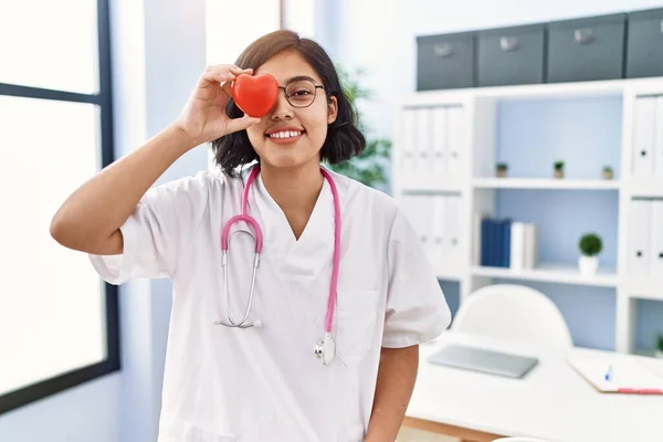 Young Latin Woman Wearing Doctor Uniform Holding Heart Eye Clinic — Stock Photo, Image