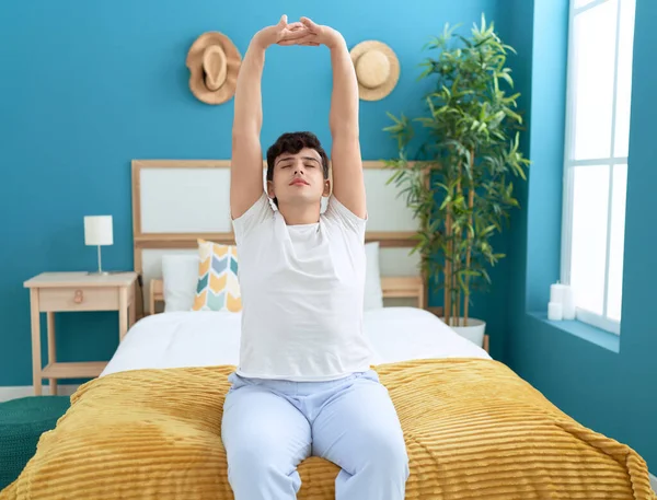 Non Binary Man Waking Stretching Arms Bedroom — Zdjęcie stockowe