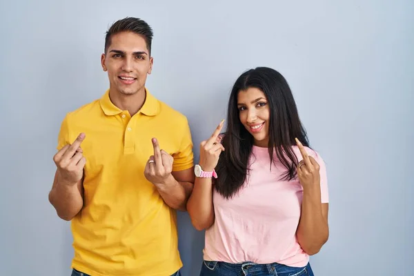 Young Couple Standing Isolated Background Showing Middle Finger Doing Fuck — Stockfoto