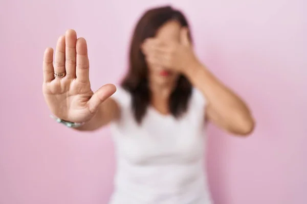 Middle Age Brunette Woman Standing Pink Background Covering Eyes Hands — Photo