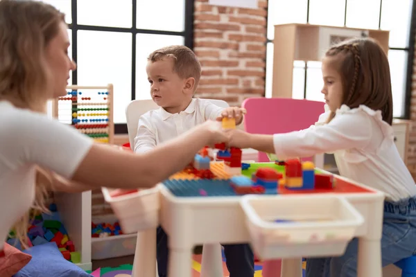 Teacher Boy Girl Playing Construction Blocks Sitting Table Kindergarten — Stock Photo, Image