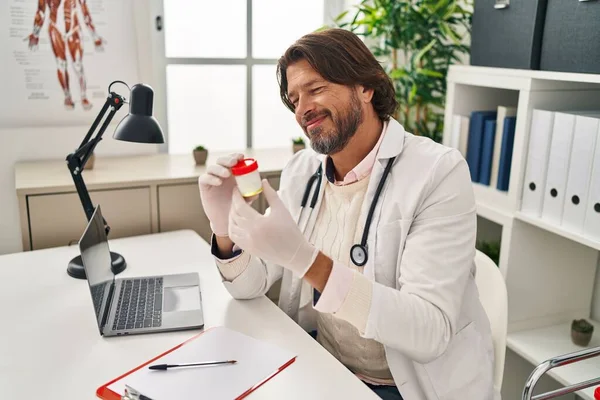 Middle Age Man Doctor Holding Urine Test Tube Clinic — Fotografia de Stock