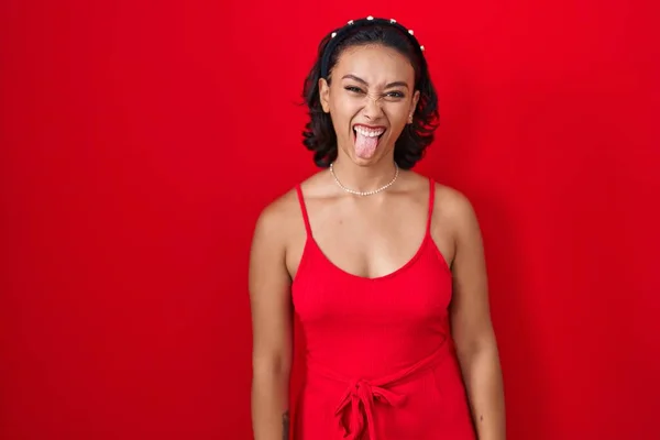Young Hispanic Woman Standing Red Background Sticking Tongue Out Happy — Photo