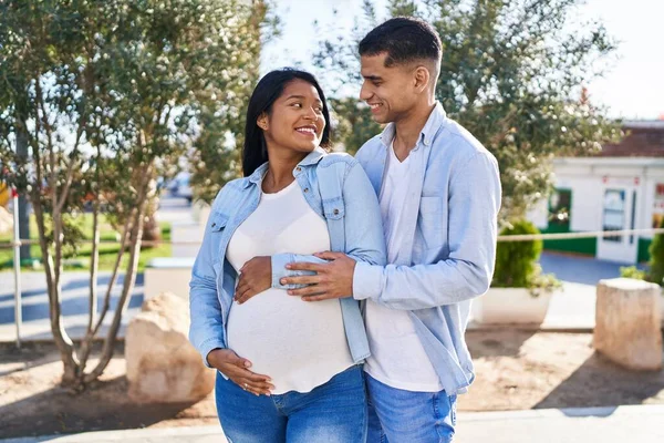 Young Latin Couple Expecting Baby Hugging Each Other Standing Park — Foto de Stock