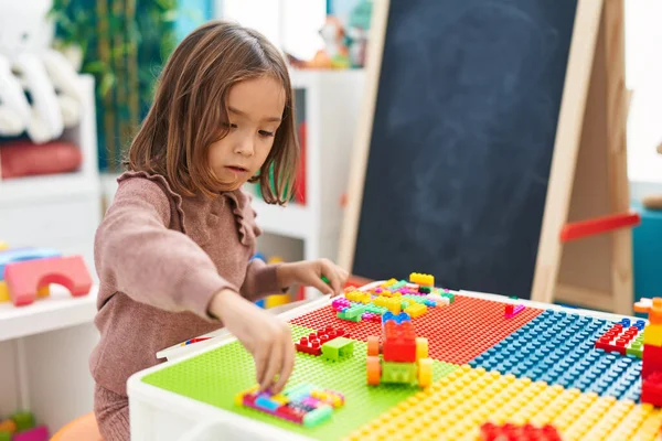 Adorable Hispanic Girl Playing Construction Blocks Sitting Table Kindergarten — Stock Photo, Image