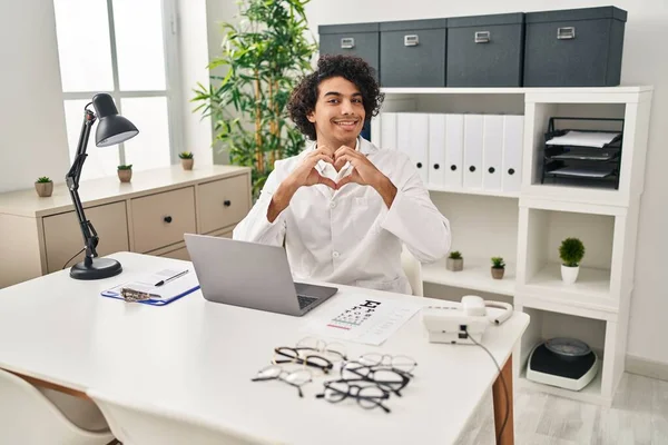 Hispanic Man Curly Hair Working Optician Office Smiling Love Doing — Stockfoto