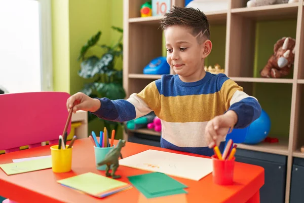 Adorable Hispanic Boy Preschool Student Sitting Table Drawing Paper Kindergarten — Fotografia de Stock