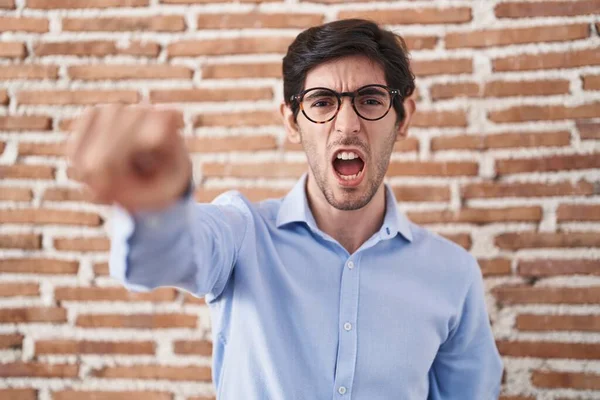 Young Hispanic Man Standing Brick Wall Background Pointing Displeased Frustrated — 图库照片