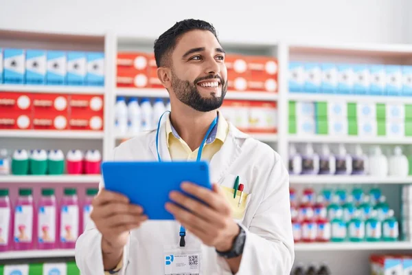Young Arab Man Pharmacist Using Touchpad Working Pharmacy — Stockfoto