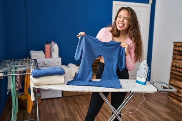 Young Hispanic Woman Ironing Holding Burned Shirt Laundry Room Sticking — Zdjęcie stockowe