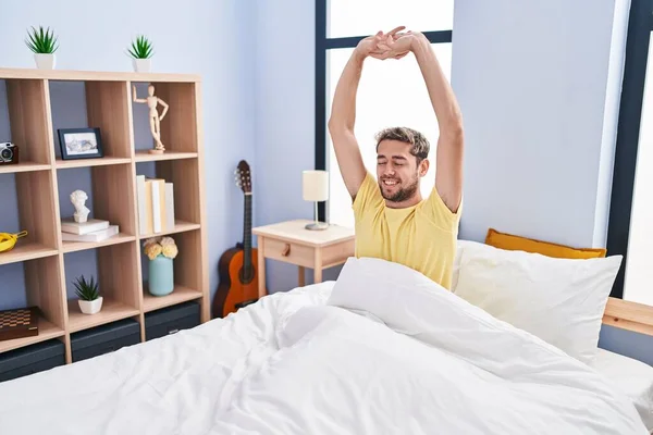 Young Man Waking Stretching Arms Bedroom — Foto Stock