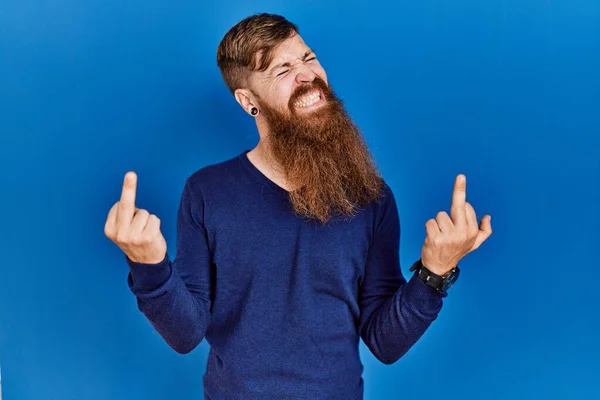 Redhead Man Long Beard Wearing Casual Blue Sweater Blue Background — Zdjęcie stockowe