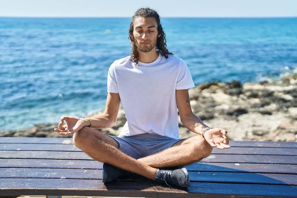 Young Hispanic Man Doing Yoga Exercise Sitting Bench Seaside — Stock Photo, Image