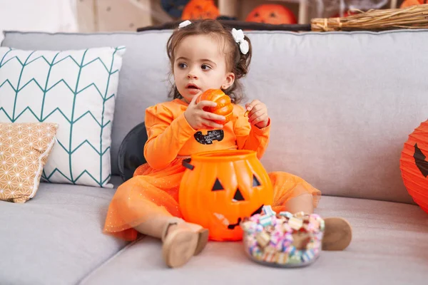 Adorable Hispanic Toddler Having Halloween Party Holding Pumpkin Toy Home — Stok fotoğraf
