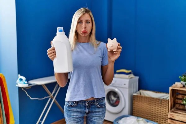Beautiful Woman Doing Laundry Holding Detergent Bottle Piggy Bank Depressed — Stok fotoğraf