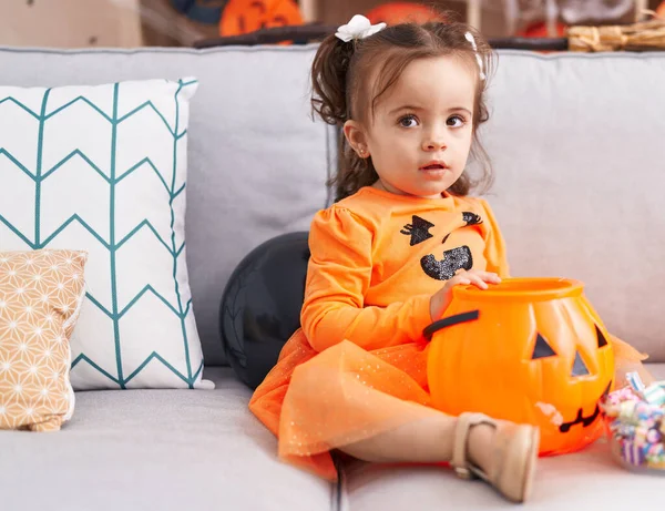 Adorable Hispanic Toddler Having Halloween Party Sitting Sofa Home — Stok fotoğraf