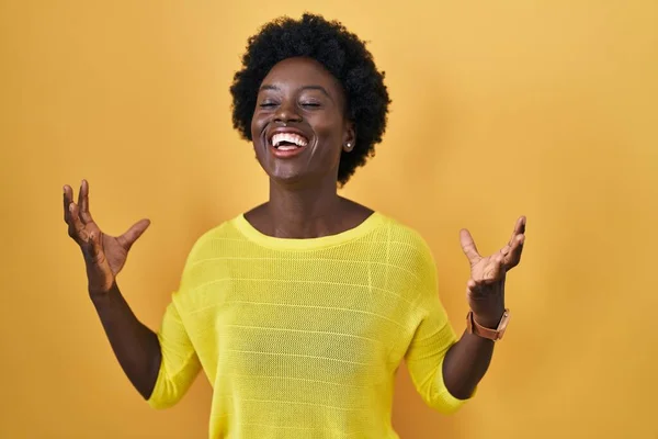 African Young Woman Standing Yellow Studio Celebrating Mad Crazy Success — ストック写真