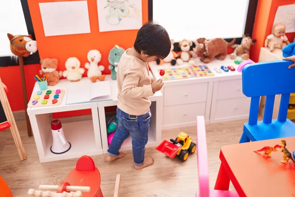Adorable Hispanic Boy Standing Back View Holding Lollypop Kindergarten — Stock Photo, Image