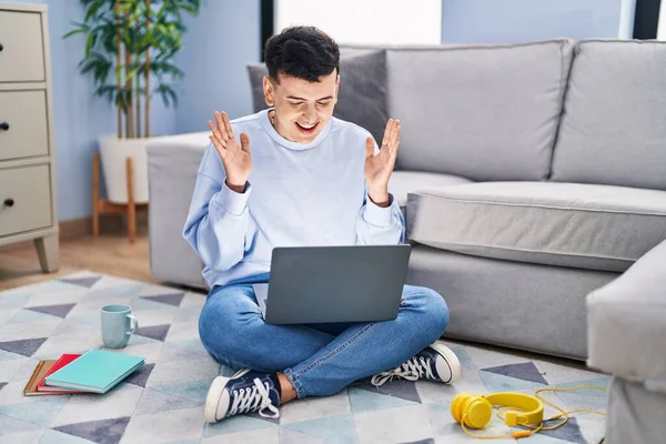 Non Binary Person Studying Using Computer Laptop Sitting Floor Celebrating — Stockfoto