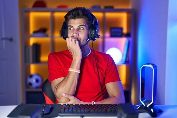 Young Hispanic Man Playing Video Games Looking Stressed Nervous Hands — Stock fotografie