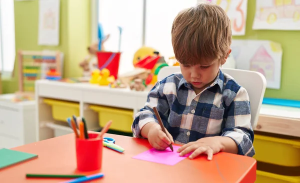 Adorable Hispanic Boy Preschool Student Sitting Table Drawing Paper Kindergarten — Stockfoto