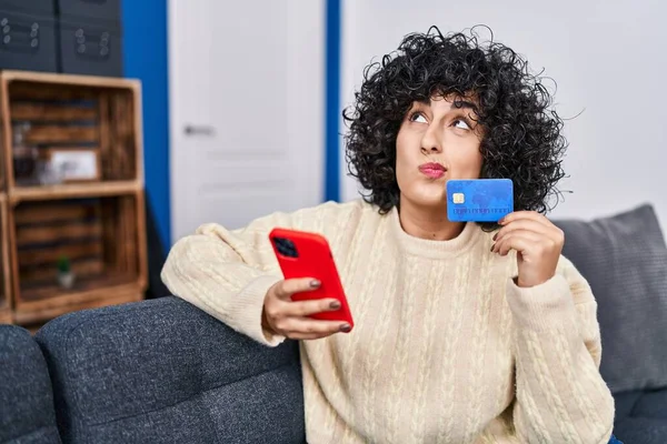 Young Middle East Woman Using Smartphone Credit Card Sitting Sofa —  Fotos de Stock
