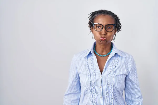 African Woman Dreadlocks Standing White Background Wearing Glasses Puffing Cheeks — Zdjęcie stockowe