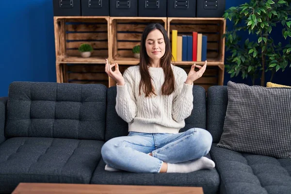 Young Woman Meditating Doing Yoga Exercise Sitting Sofa Home — Foto Stock