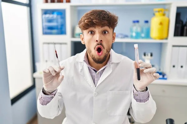Arab Man Beard Working Scientist Laboratory Holding Blood Sample Afraid — Stockfoto